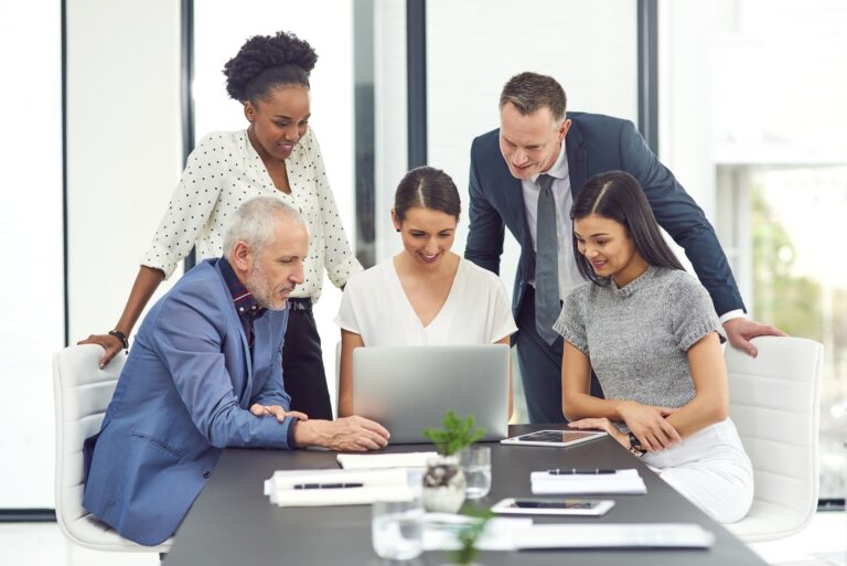 Talking business. Cropped shot of a group of businesspeople having a meeting together in an office.